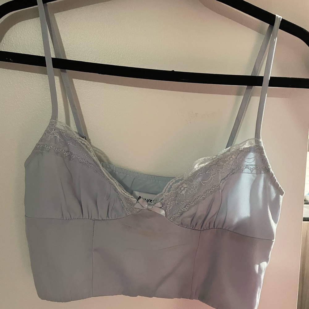 Princess Polly blue cropped tank top with lace details and hidden zipper.